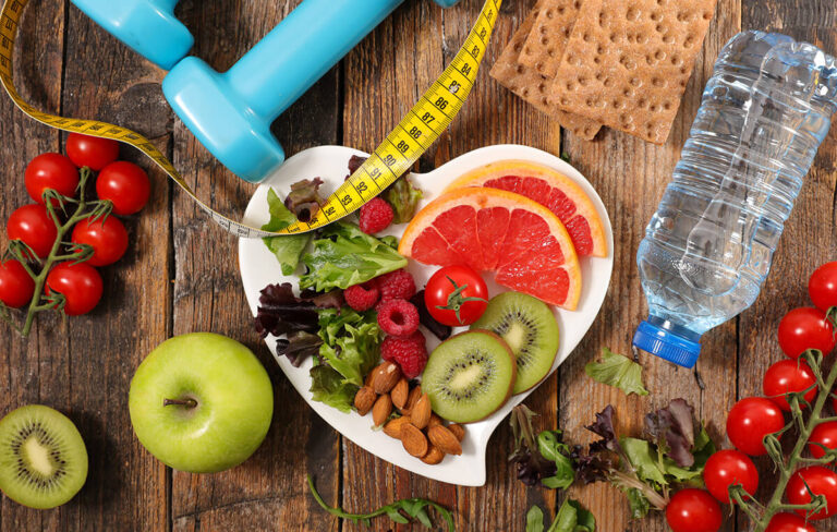 sliced up fruits in a heart shaped plate